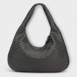 Cristina – Bolso de mano trenzado y moderno