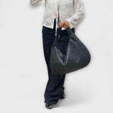 Cristina – Bolso de mano trenzado y moderno